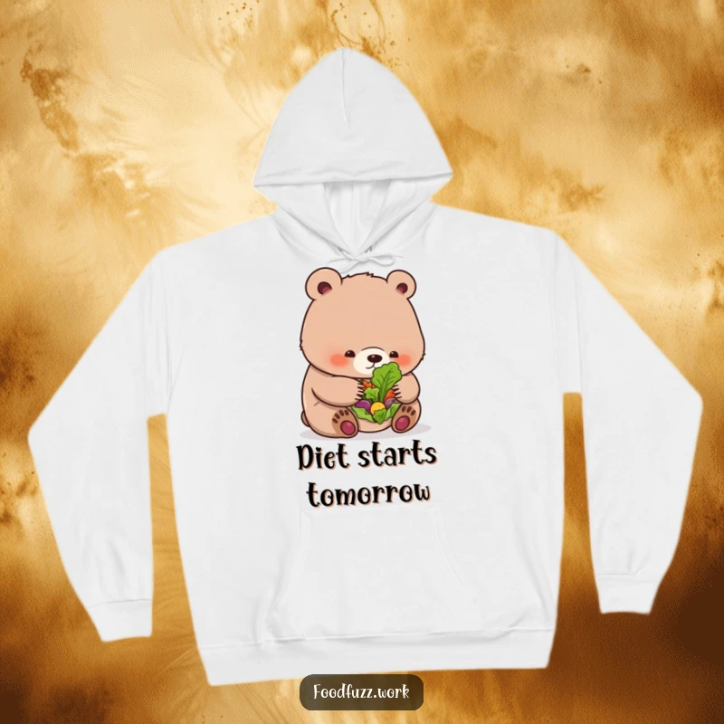 Funny bear cub hoodie looking quizzically at a small salad, perfect for cozy, humorous, healthy eating fans.