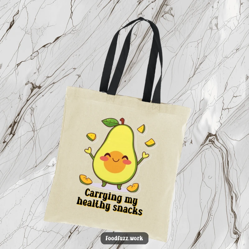 Funny Tote Bag with a smiling avocado character happily juggling tiny fruit slices, perfect for carrying essentials with a playful, humorous touch.